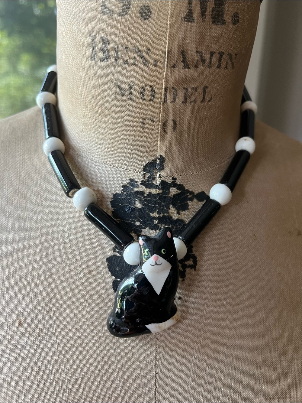 Flying Colors Black white porcelain cat necklace. 16”